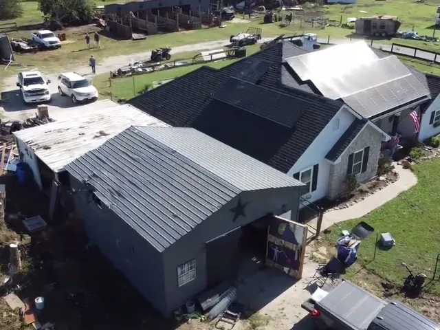 Aerial view of tornado damage to homes in Sanger, TX before restoration